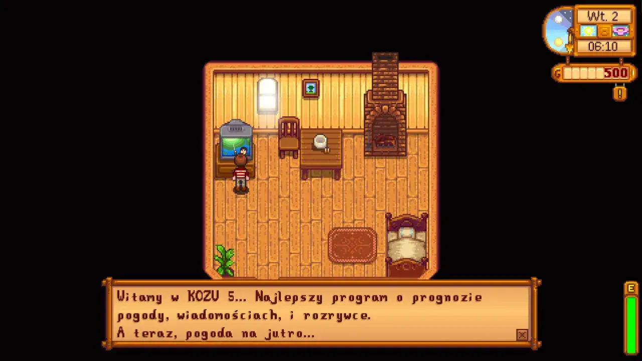 Postać w grze Stardew Valley stoi w pokoju obok telewizora, na którym wyświetla się tekst.